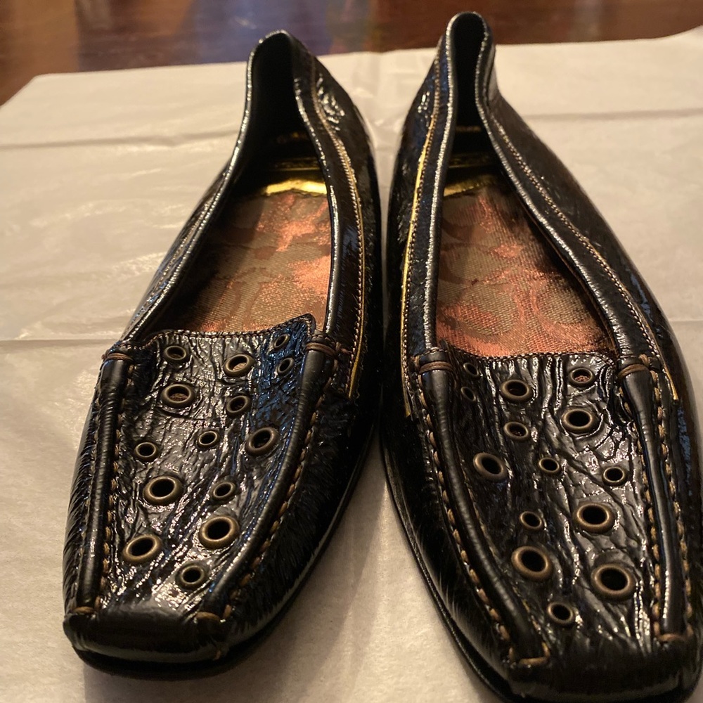 Authentic Coach flats very different from the traditional signature flats